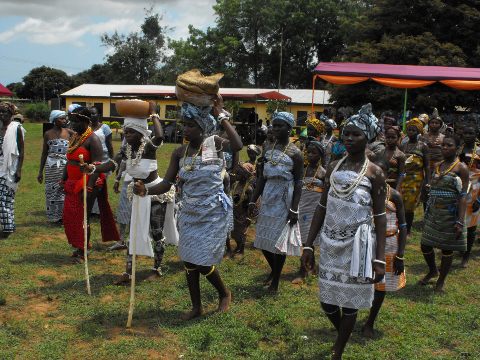 Women Bringing Traditional Items