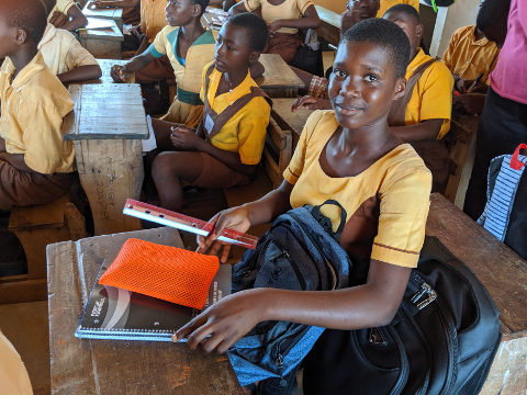 Student with contents of backpack
